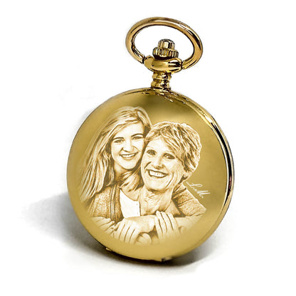 Reloj de bolsillo dorado a cuerda